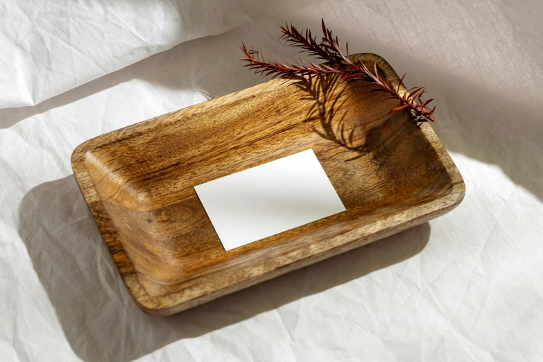 a wooden container with some plants on top of it