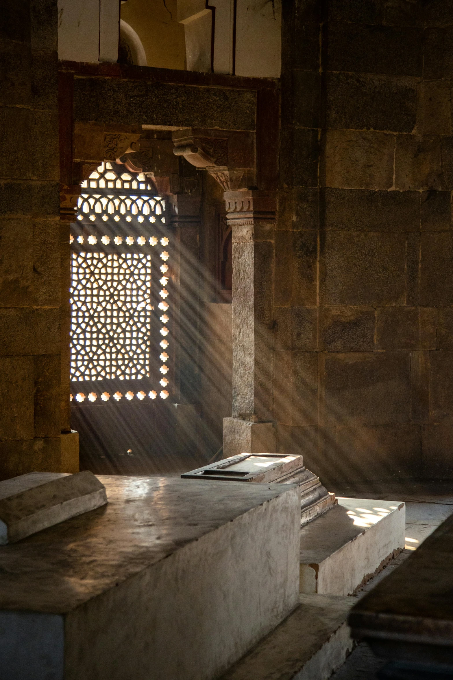 the sunlight is shining through an arched window