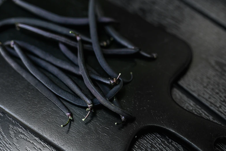 a group of black plastic wrapped wires attached to an electric guitar