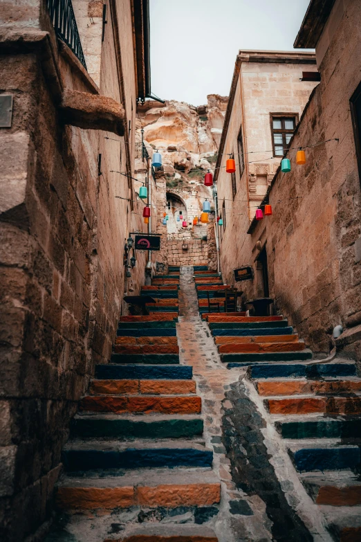 an old narrow alley with some stairs down the center