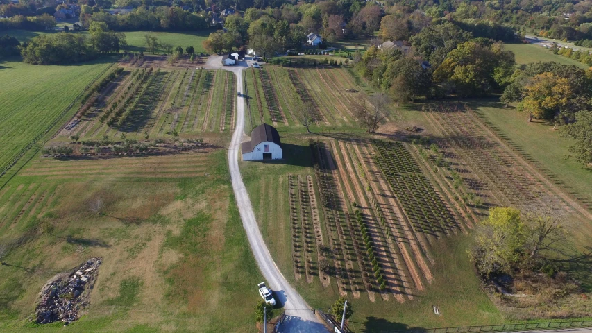 an aerial view of a farm and buildings