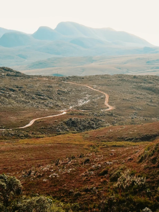 a road on a dry, rocky hillside