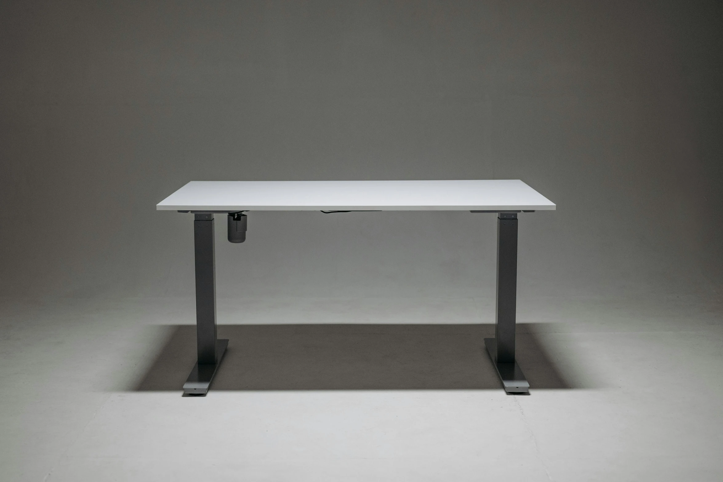 a white table sitting on top of a black surface