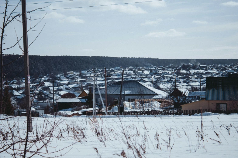 a view of a snowy city in a rural area