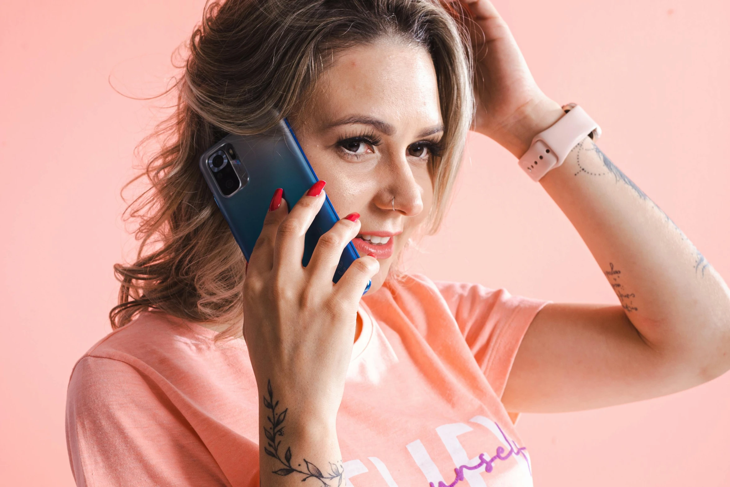 a beautiful young woman talking on a cell phone