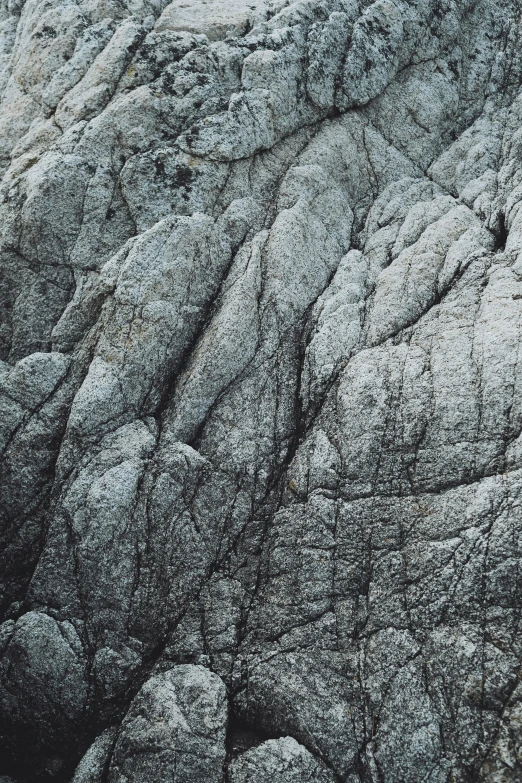 an aerial view of some rocks in the grass