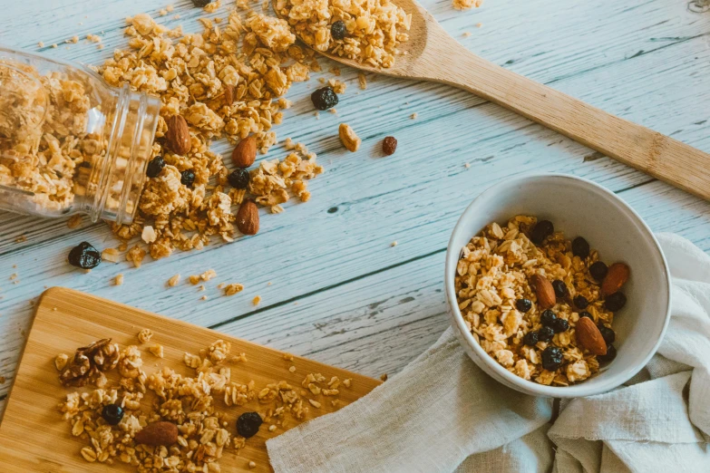 a bowl of oatmeal next to a spoon