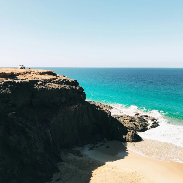 the ocean is clean and clear as well as the cliffs