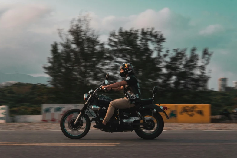 a person that is riding a motorcycle on the street