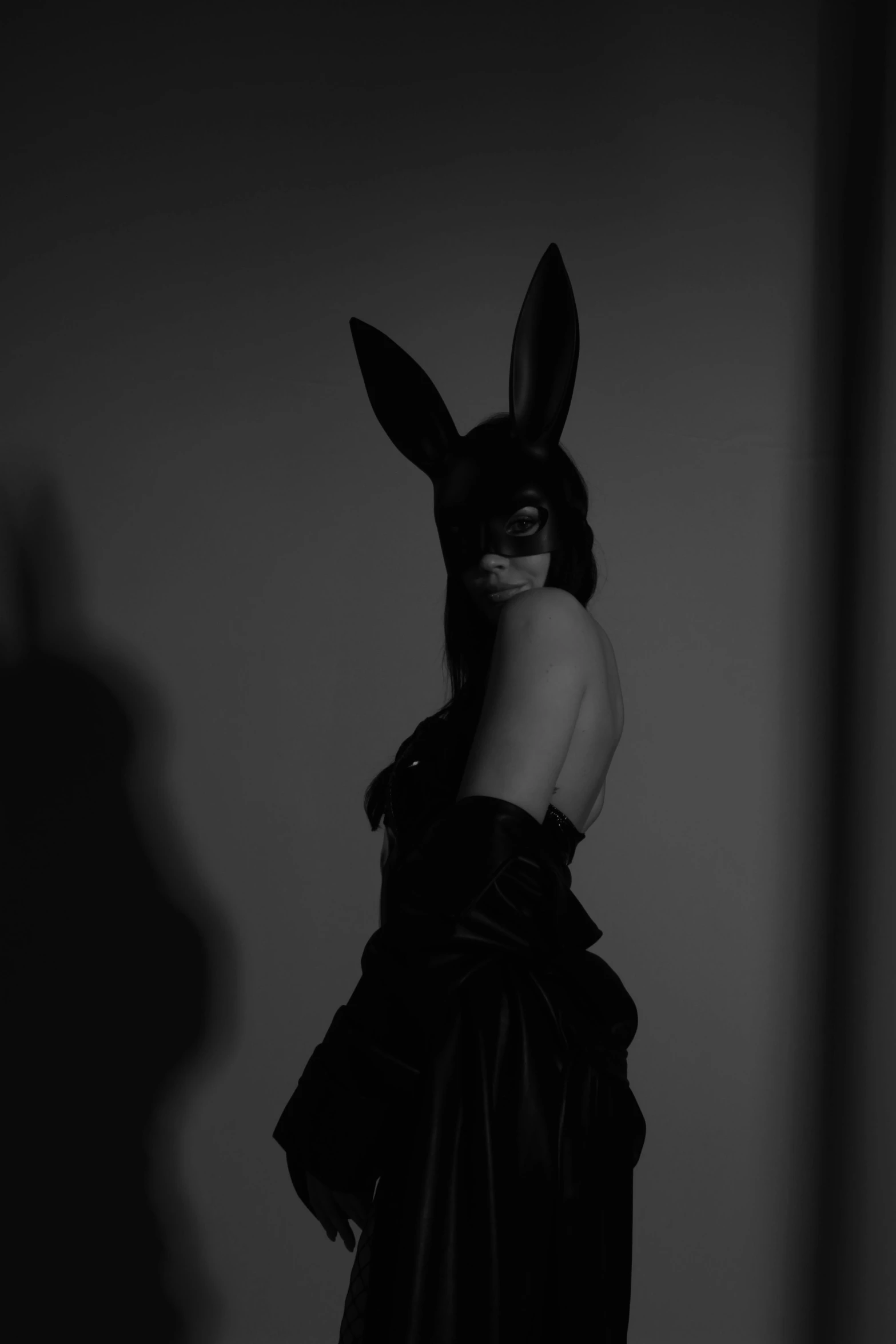 a woman with bunny ears on is standing