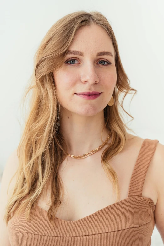 a woman with long blonde hair posing for a po