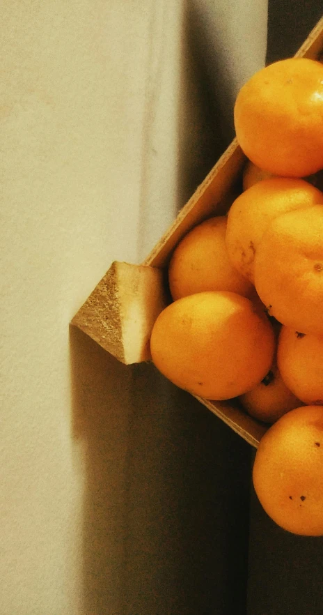 some yellow and brown fruit are in a box