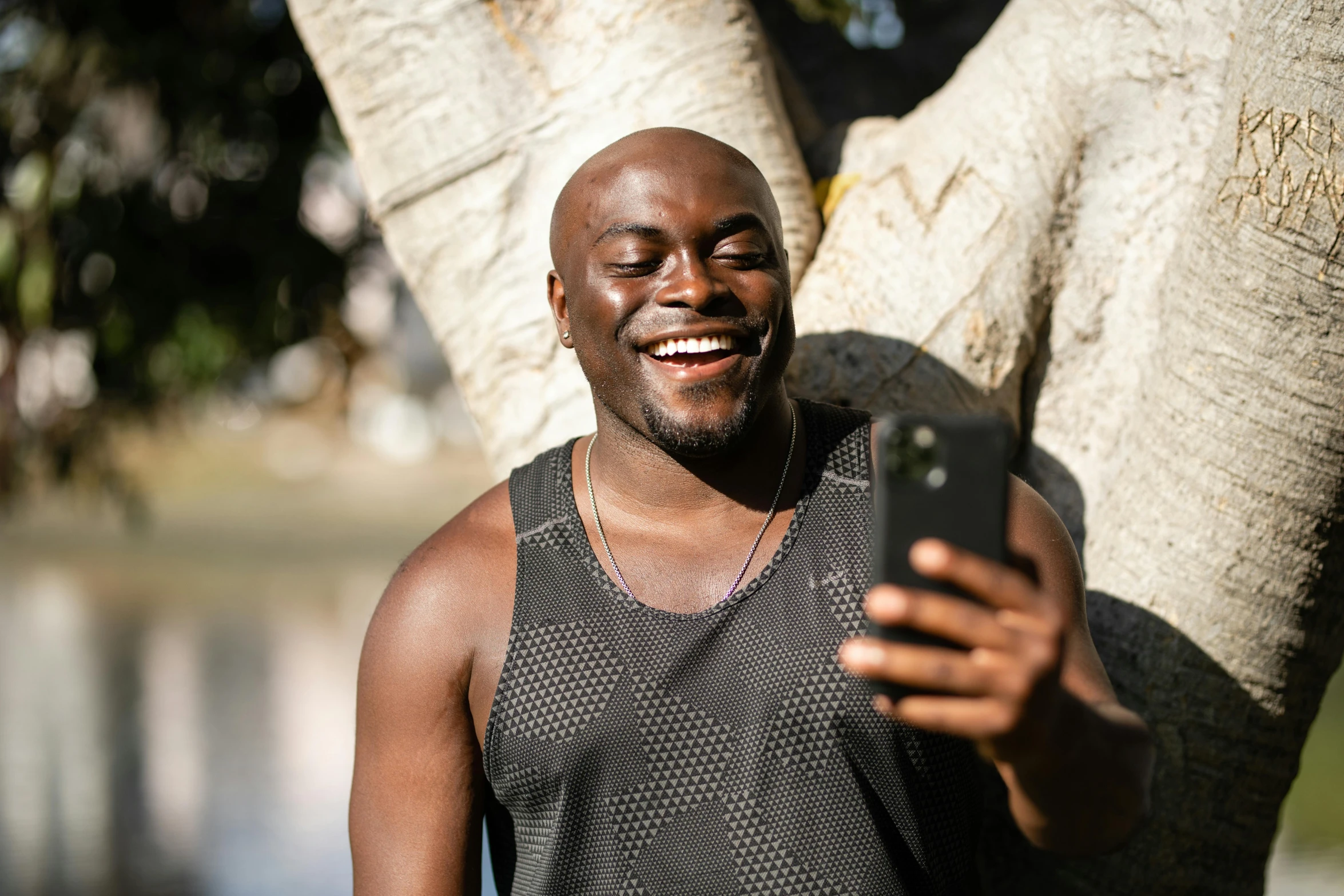 a man that is looking at a cellphone