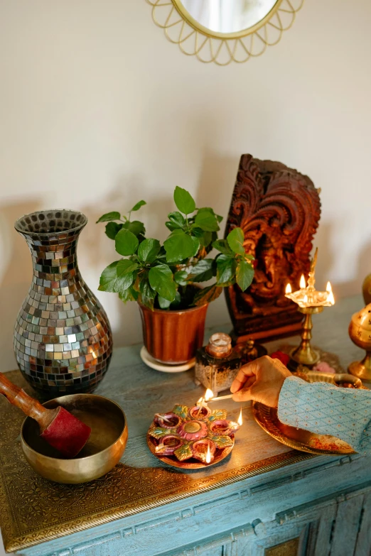 a bunch of candles sit on a table