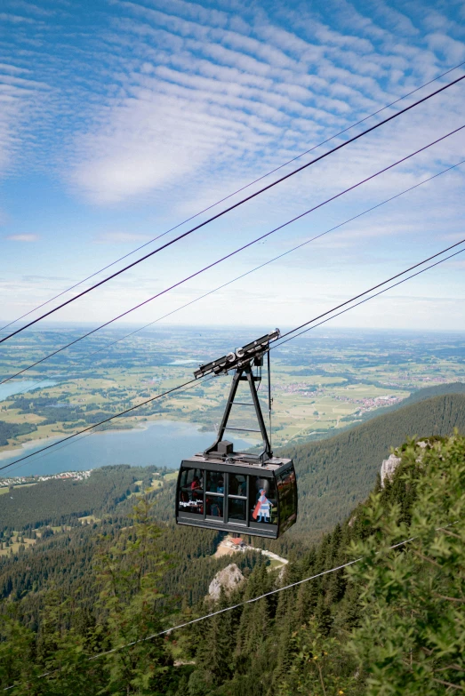 a view from the top of a ski lift as they travel over a valley