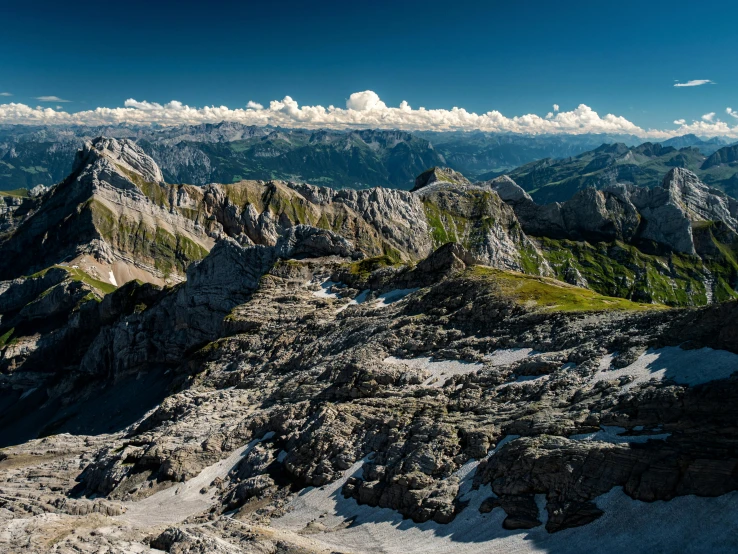 there are lots of mountains that appear to have steep, rocky sides