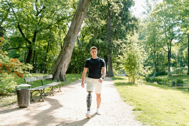 a man riding a skateboard through a park