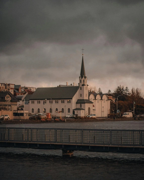 a city sits in the distance under cloudy skies