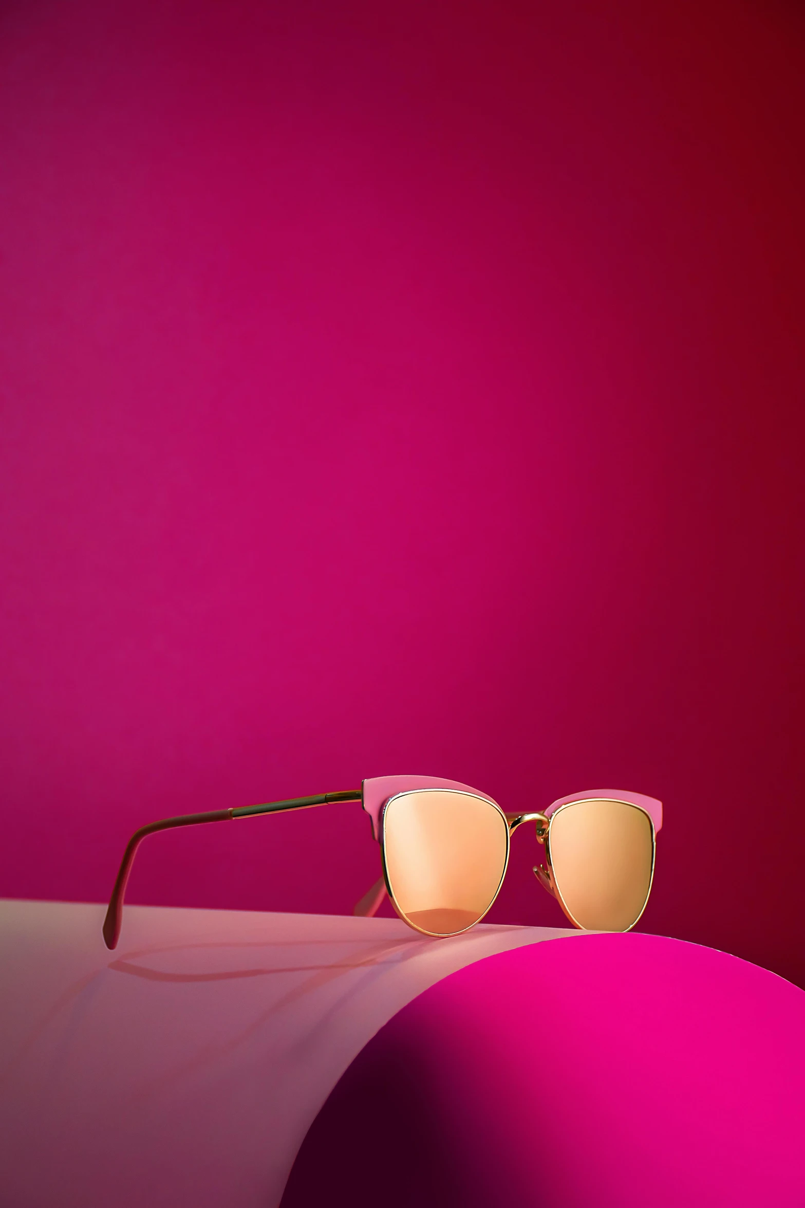 a pair of glasses with pink tinted lenses