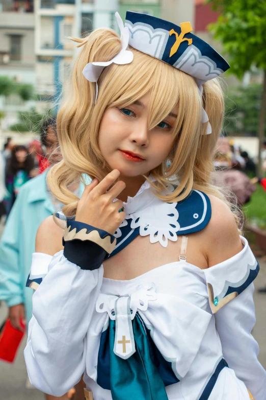 a blonde wigd girl dressed in a sailor outfit