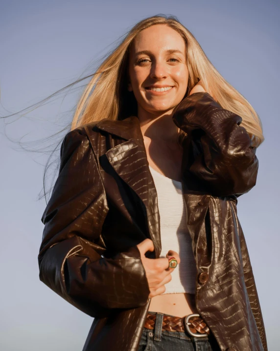 a close up of a person in a leather jacket