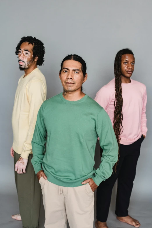 three men are standing with their faces painted