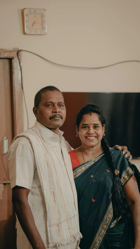 a man and woman standing in a living room