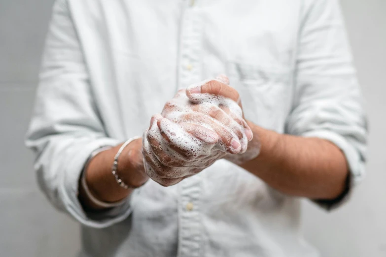 a person holding a doughnut in their hand