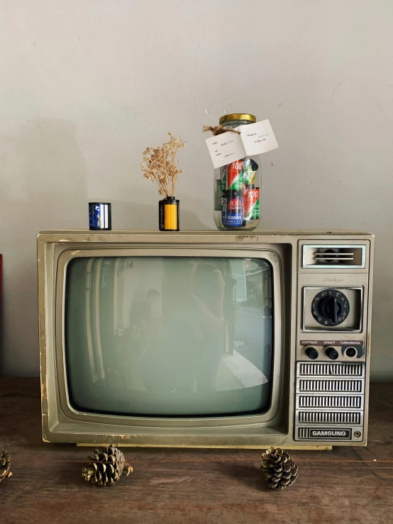 an old tv that is sitting on a table