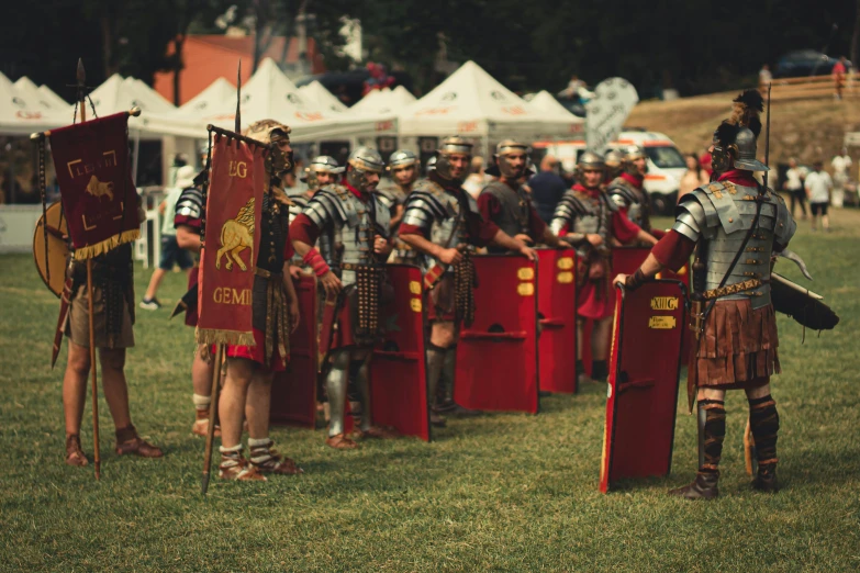 a bunch of knights with their flags standing in front of some barriers