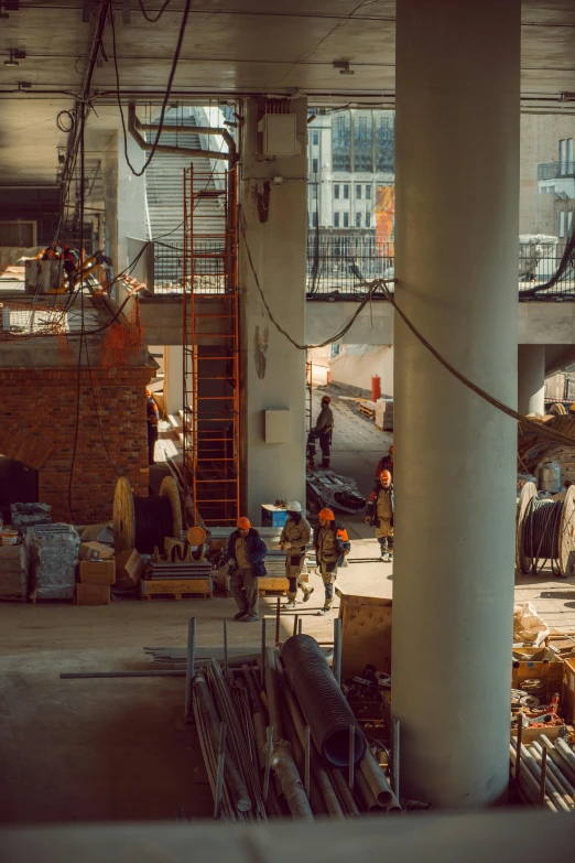 there are two men working in the construction of the building