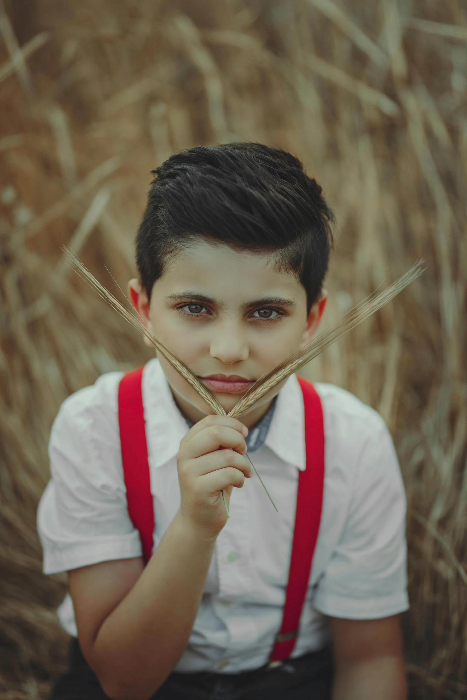 the boy is holding some type of long stick