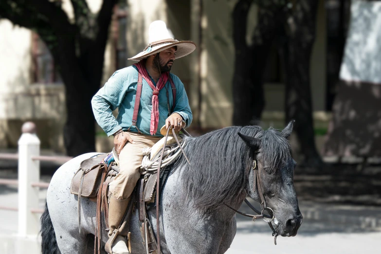 a man is riding a horse in the middle of a street