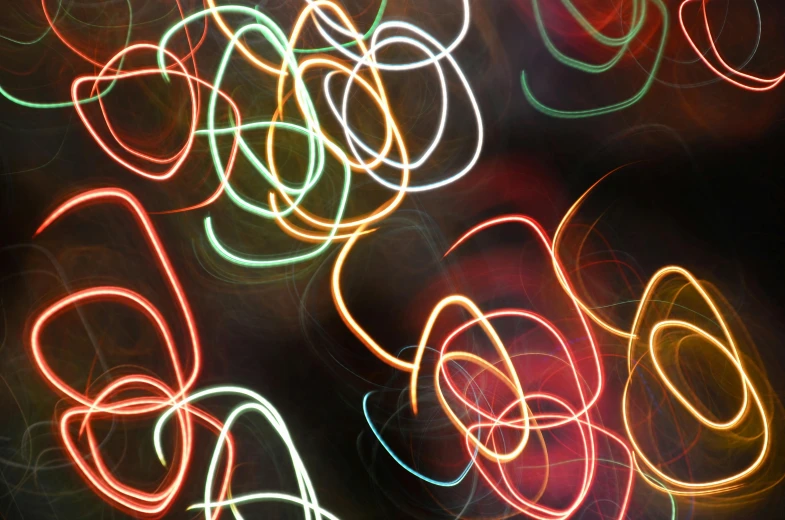 blurry pograph of colorful lights against a black background