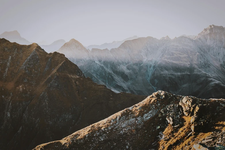 a snow covered mountain range, taken from the top