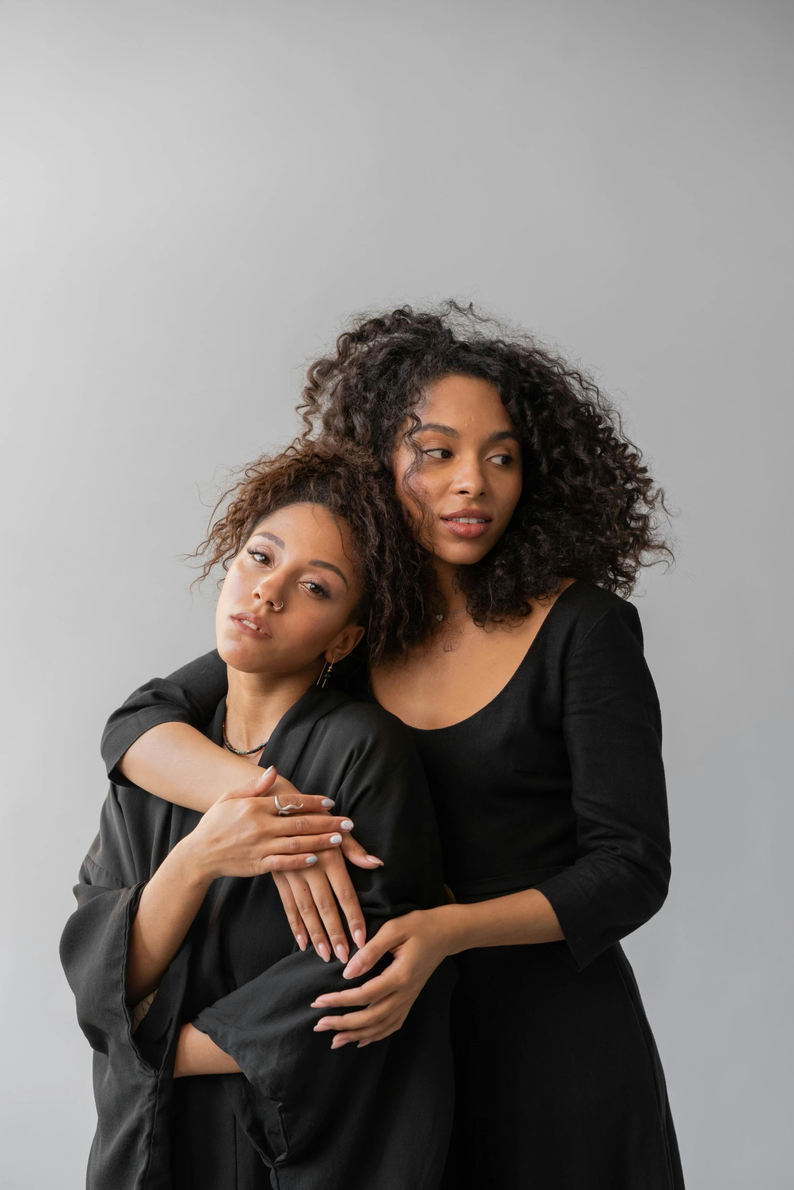 two african american women are hugging each other