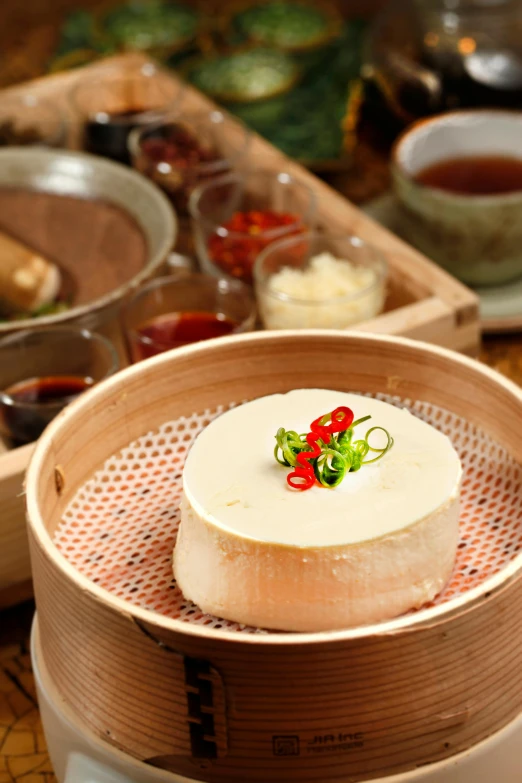 a wooden bowl with three sides that hold three different kinds of food
