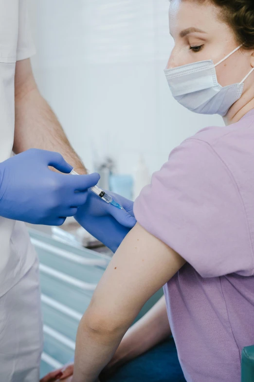 a woman is being cared for a patient