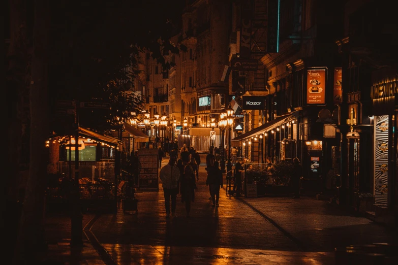 a group of people that are standing on a sidewalk