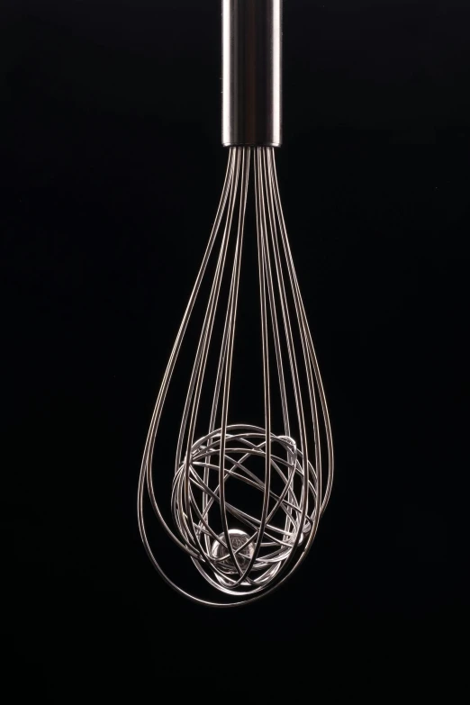 a light bulb suspended on black background