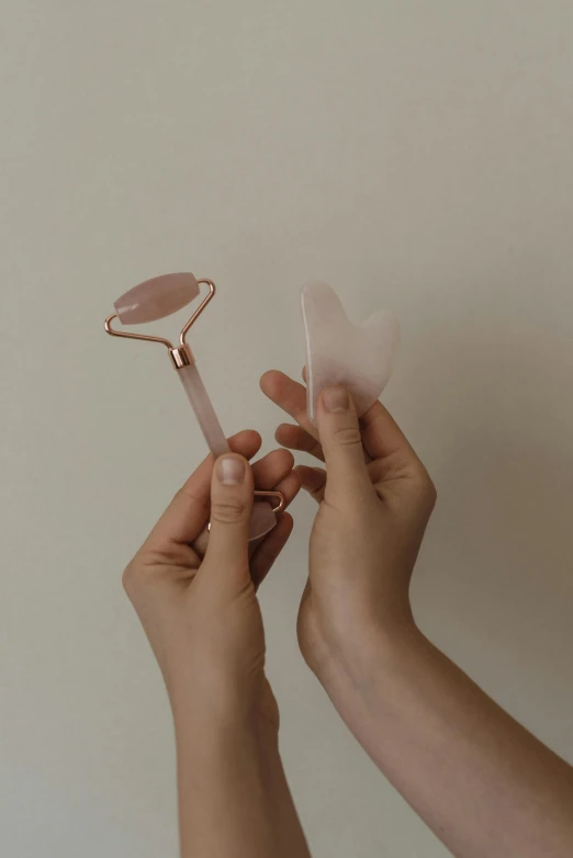 someone holding up a hairbrush to another person's face