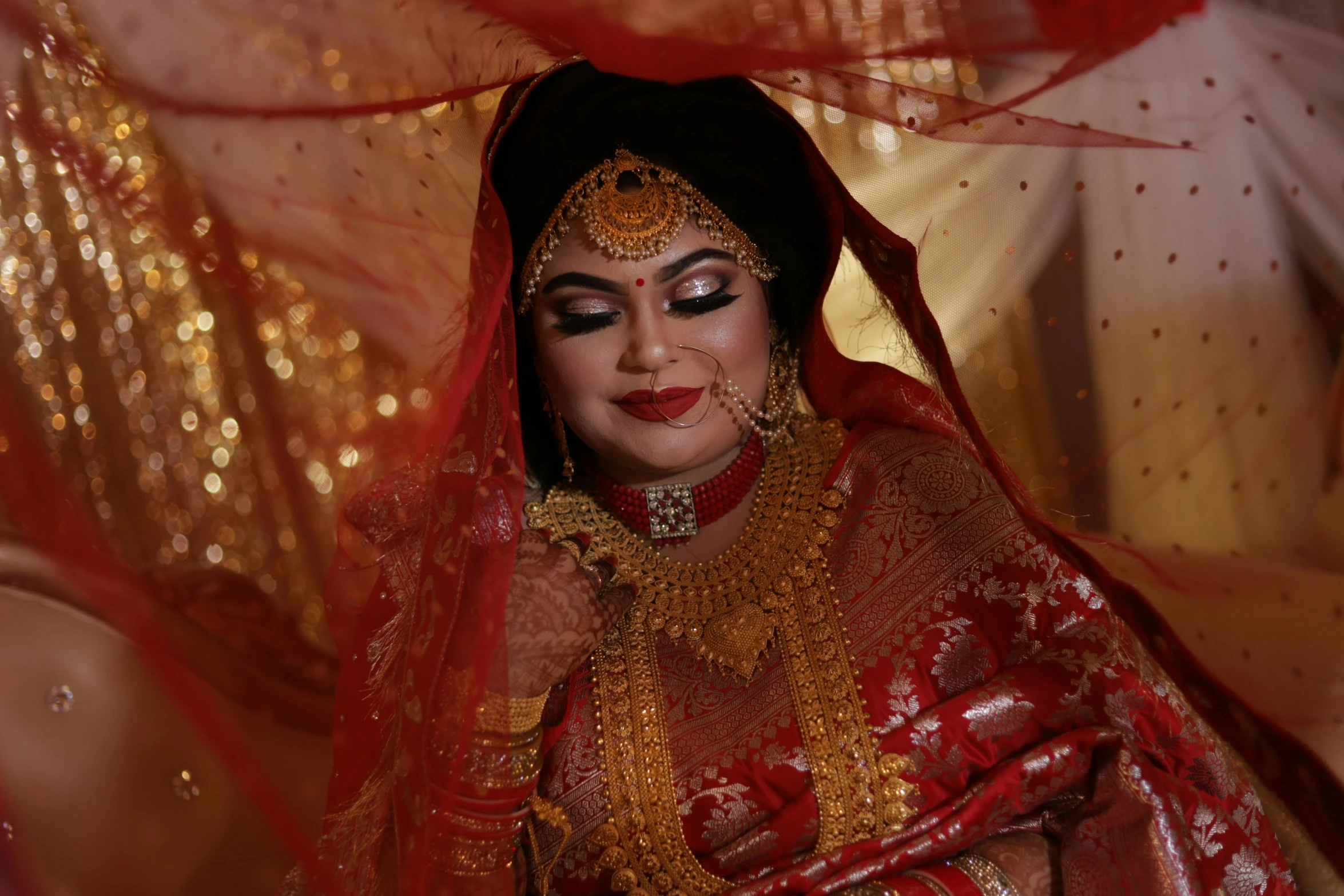 a women wearing a red and gold costume