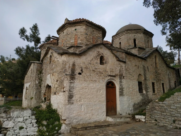 an old stone church with many towers and windows