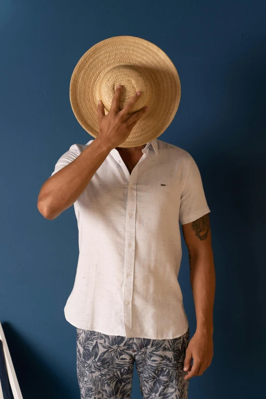 a person with a straw hat posing for a picture