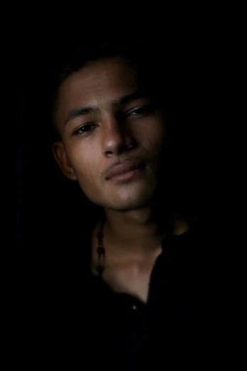 a dark, dark - colored pograph of a young man