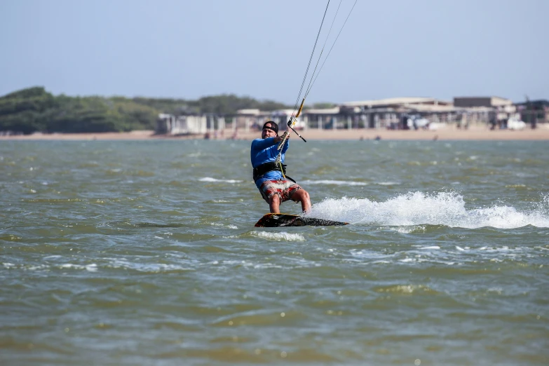 a person riding a surfboard on top of a body of water