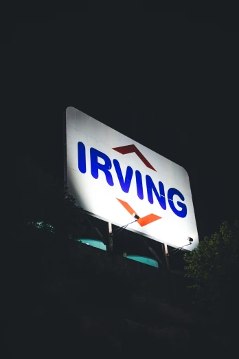 a large sign that reads irving lit up at night