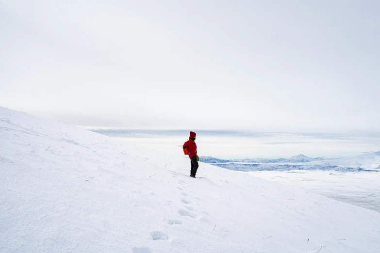 a person standing on a mountain looking down