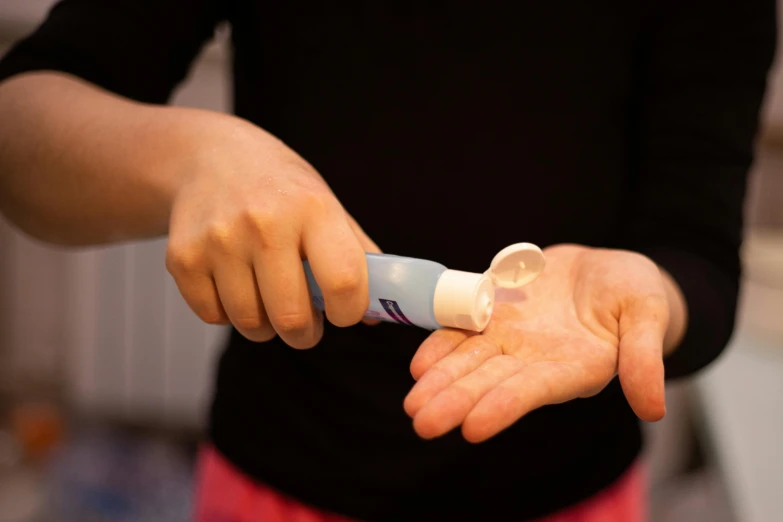 someone using an inhaler to make medicine from pills