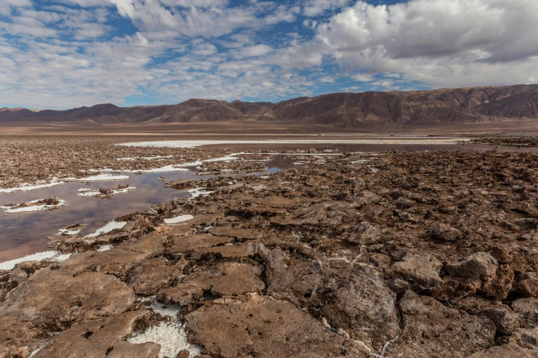 a view from a distance, of the rocky terrain and low water